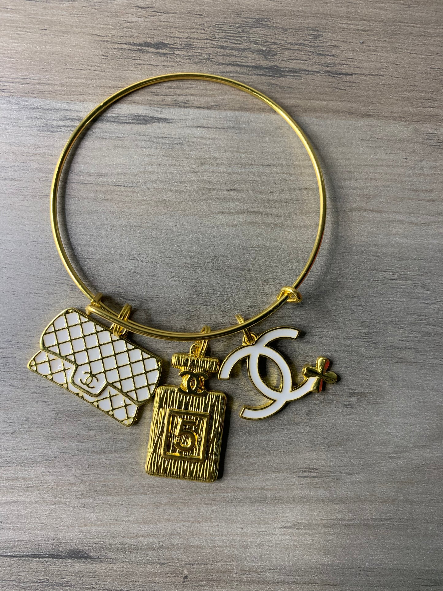 Gold Tone Bangle with Charms